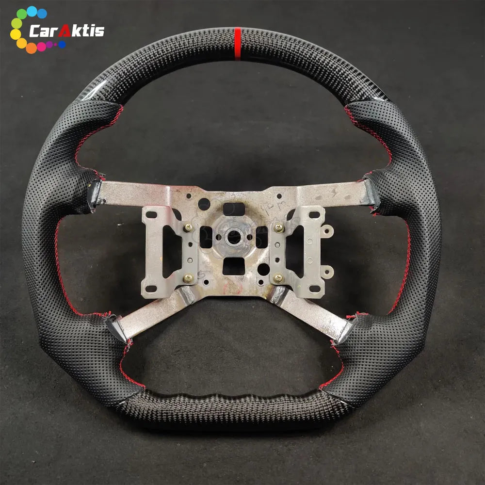 Front view of the steering wheel frame for Mitsubishi 3000GT with black perforated leather and red stitching.