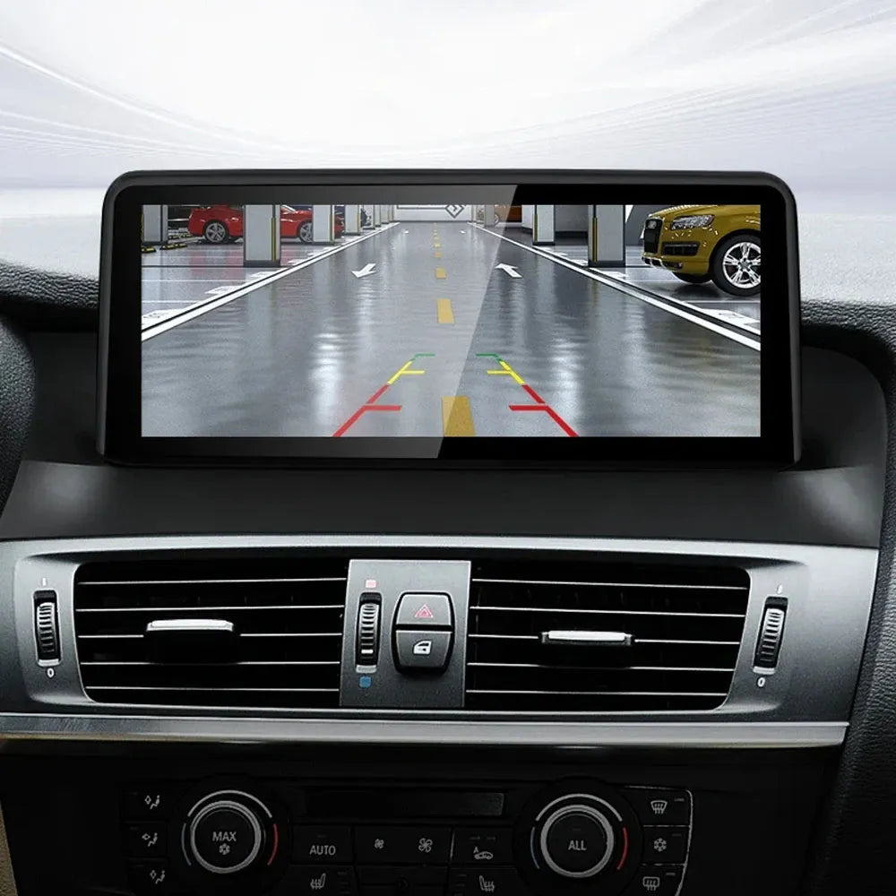Backup camera display with parking trajectory guidelines on BMW X3 F25 X4 F26 multimedia screen.