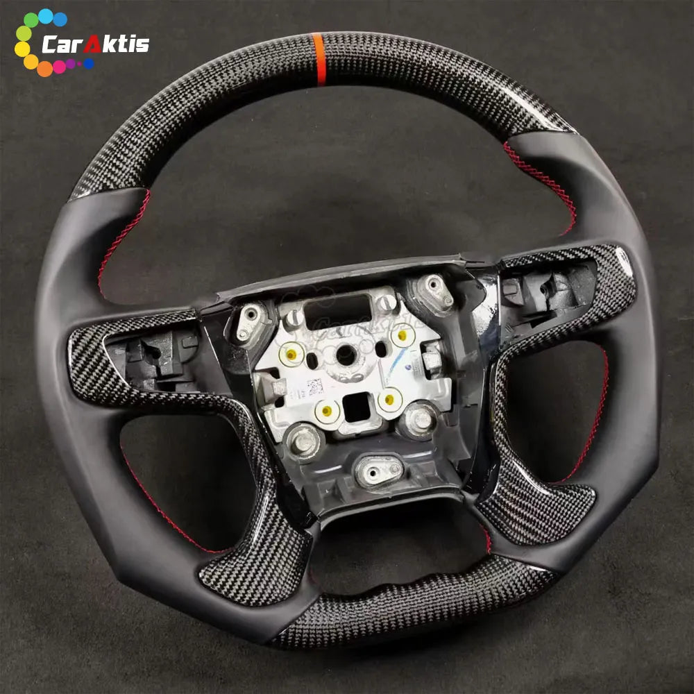 Custom Chevy Tahoe steering wheel featuring forged carbon fiber, black Alcantara, and sporty red stitching.