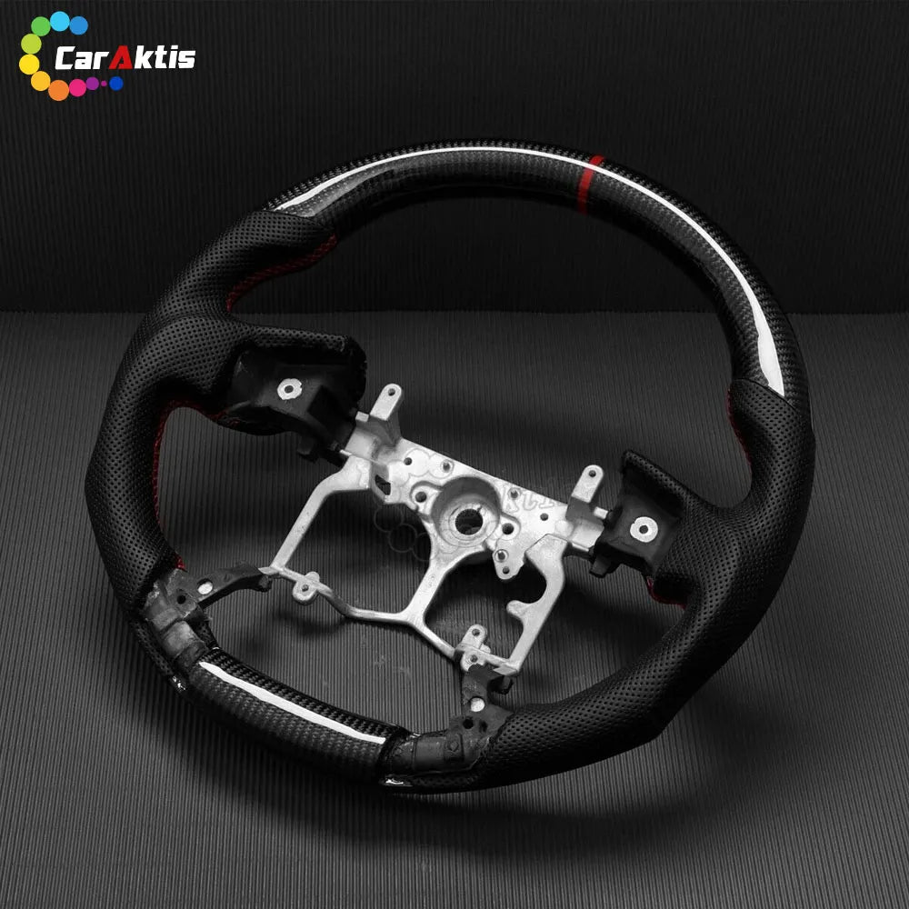 Custom Toyota steering wheel featuring a red racing stripe and high-gloss carbon fiber.