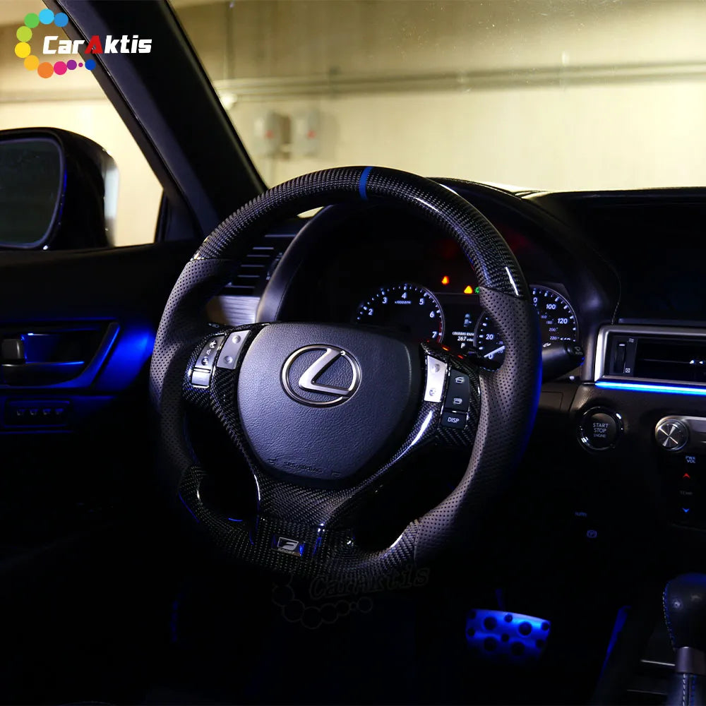 Ergonomic perforated leather grips on a custom Lexus ES carbon fiber steering wheel for enhanced handling and comfort.