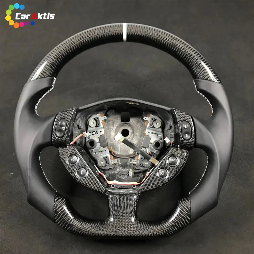 Internal view of a custom Maserati GranTurismo steering wheel showing wiring and button housing.