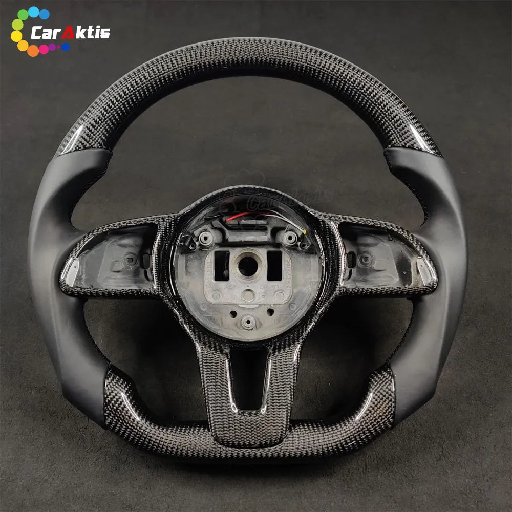 Custom carbon fiber and smooth black leather steering wheel for 2018+ Mercedes Sprinter W907/W910 models.