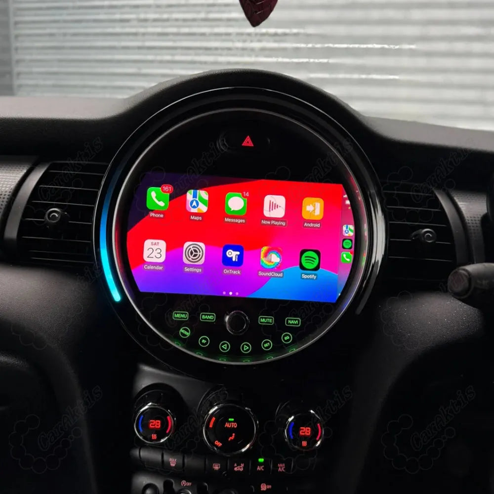 Custom circular Android multimedia player installed in BMW Mini Cooper displaying colorful app icons and LED ring light.