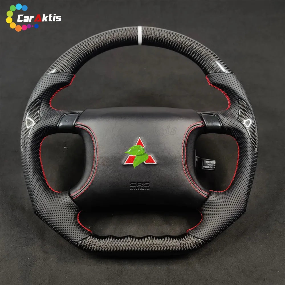 Mitsubishi 3000GT GTO custom steering wheel featuring carbon fiber, perforated leather, red stitching, and 3000GT logo.