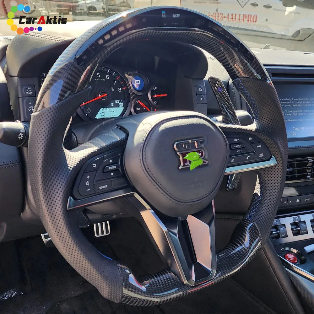 CarAktis Custom Carbon Fiber Steering Wheel with LED Performance Display for 2017-2025 Nissan GTR R35, installed view.