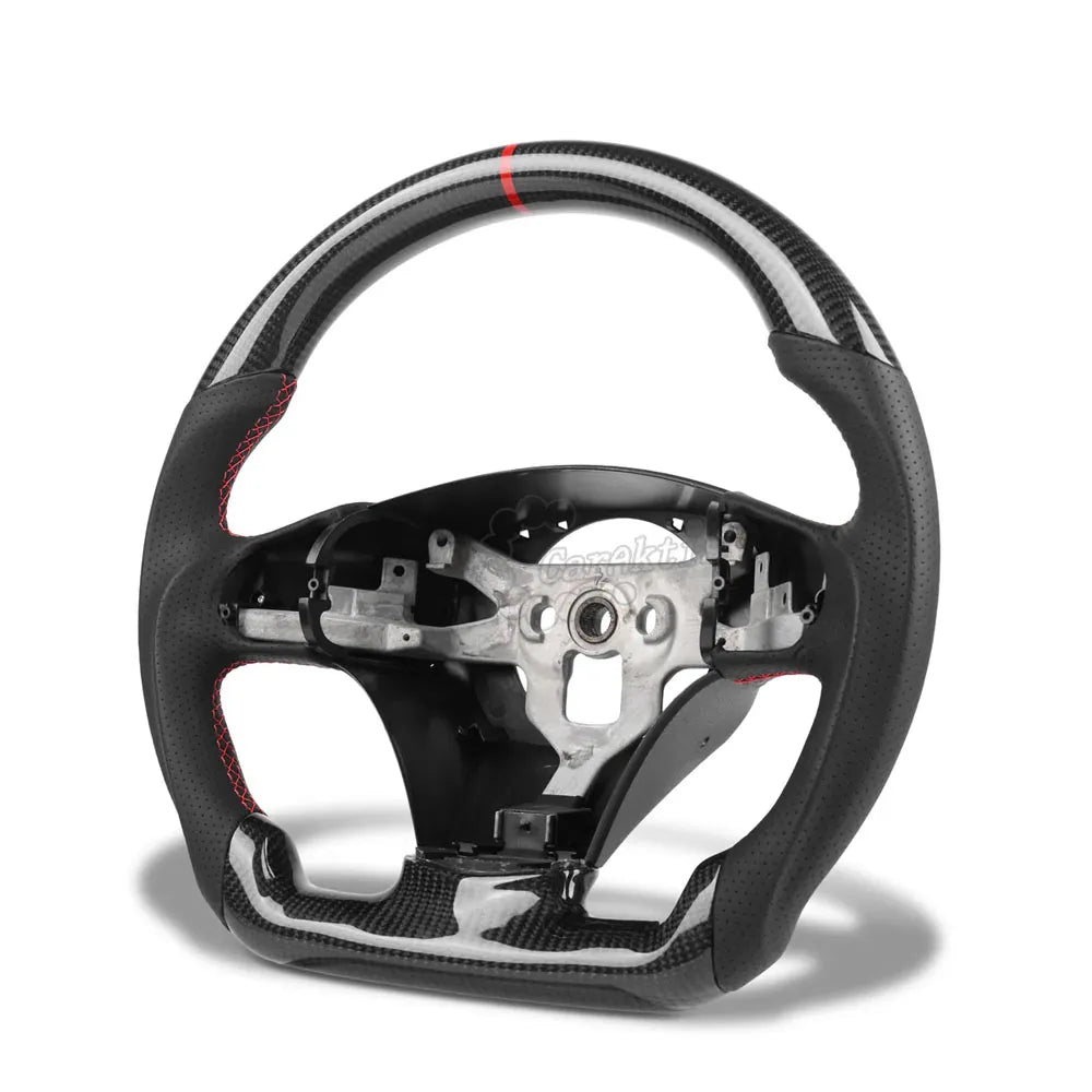 Custom carbon fiber steering wheel for 2006-2013 Chevrolet Corvette C6, featuring perforated leather grips, red contrast stitching, and a red racing stripe at the top.