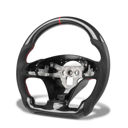 Custom carbon fiber steering wheel for 2006-2013 Chevrolet Corvette C6, featuring perforated leather grips, red contrast stitching, and a red racing stripe at the top.