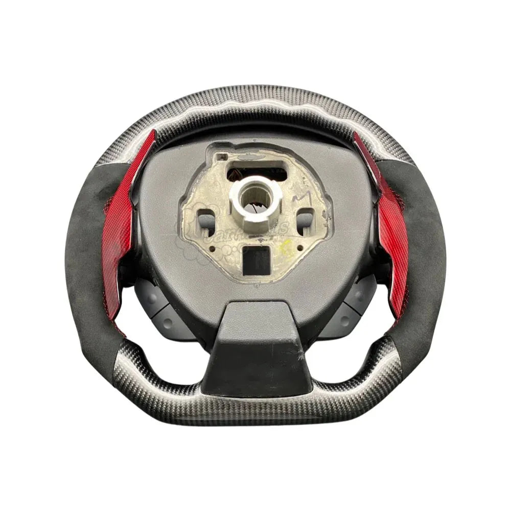 Custom Yoke style carbon fiber steering wheel with black Alcantara grips and extended red carbon fiber paddle shifters for 2012-2024 Chevrolet Camaro.