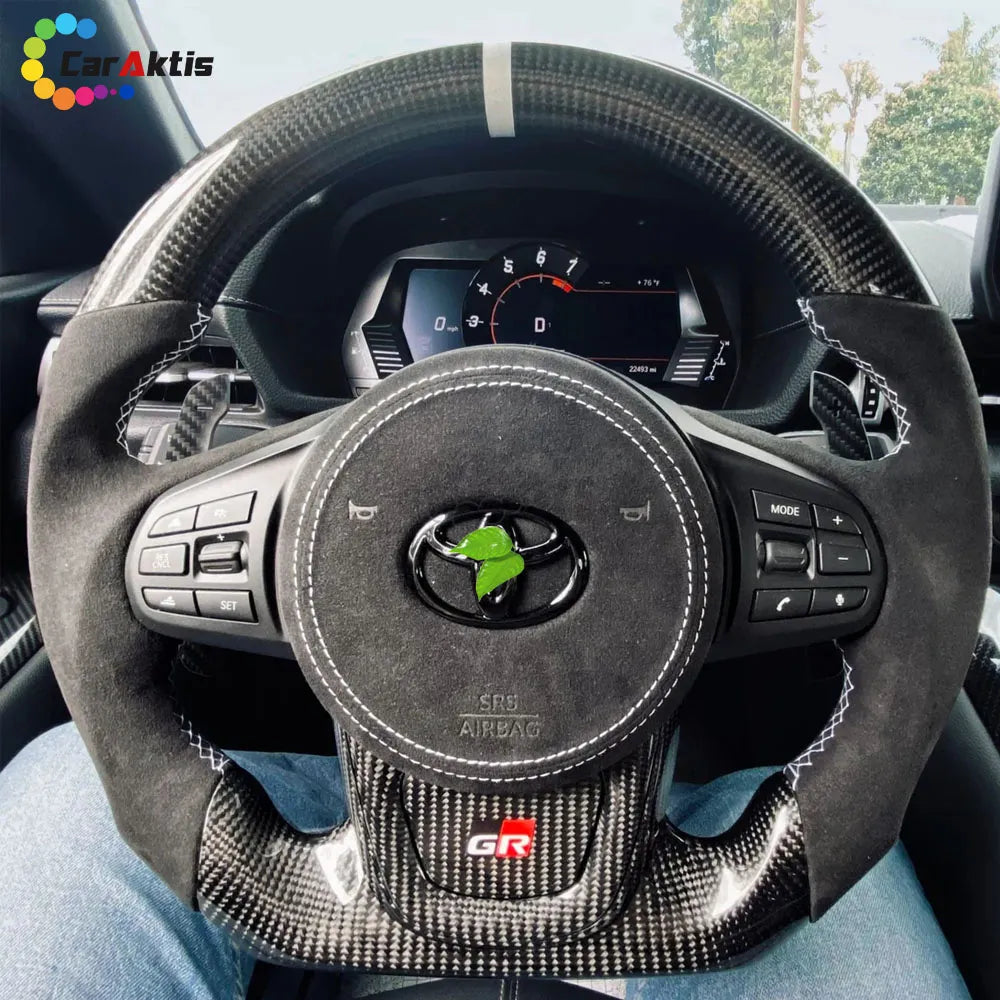 Custom steering wheel for Toyota Corolla featuring premium black suede grips for non-slip performance.