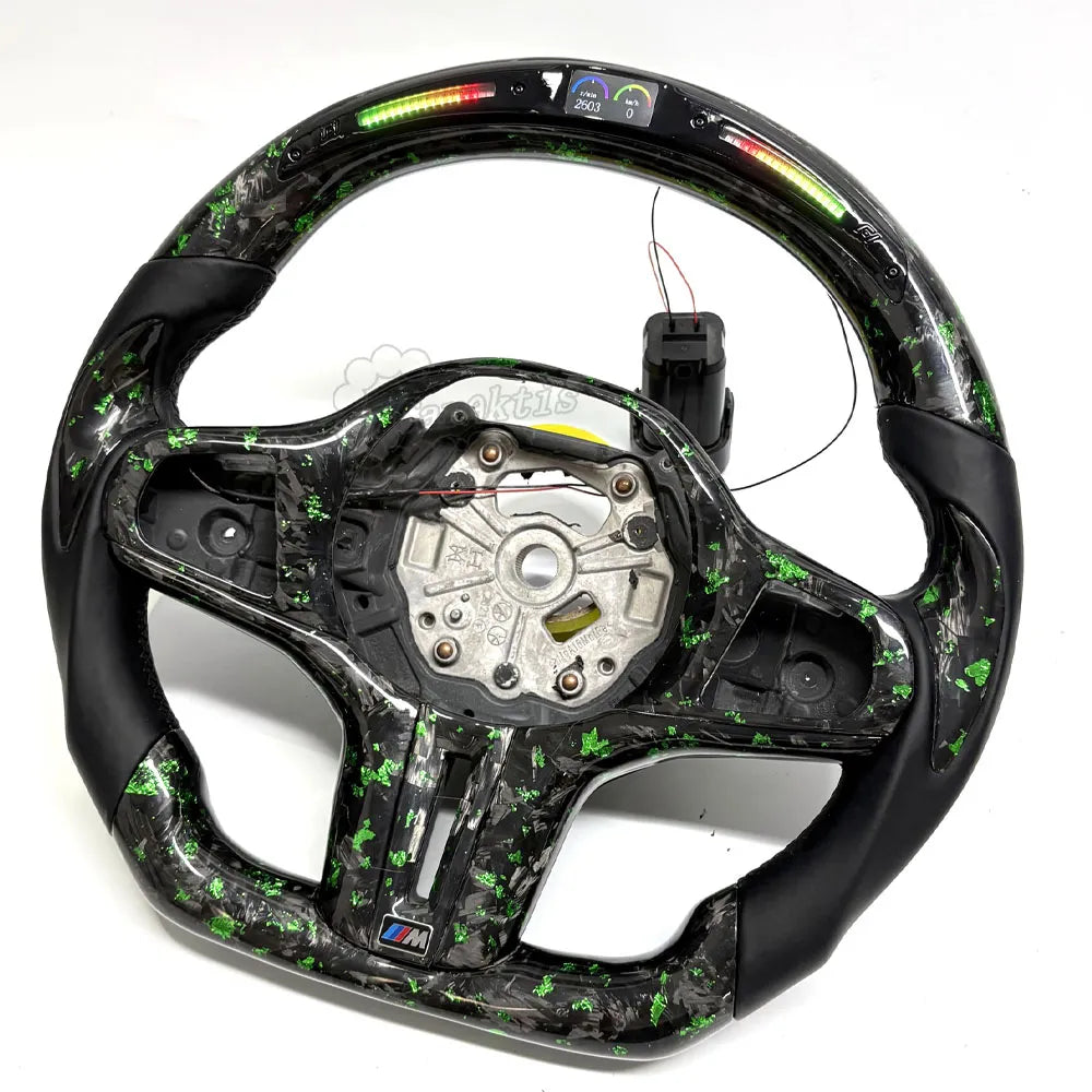 This custom-tailored steering wheel for BMW features forged carbon fiber accents on its upper and lower sections, exuding a unique, marble-like aesthetic. The grip sections are wrapped in genuine leather and complemented by an integrated LED display.