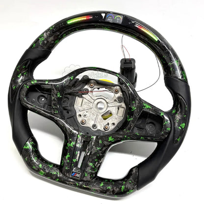 This custom-tailored steering wheel for BMW features forged carbon fiber accents on its upper and lower sections, exuding a unique, marble-like aesthetic. The grip sections are wrapped in genuine leather and complemented by an integrated LED display.
