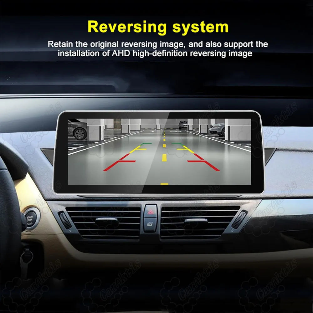AHD high-definition parking camera display with dynamic trajectory guidelines on BMW X1 E84 Android screen.