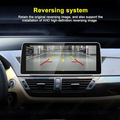 AHD high-definition parking camera display with dynamic trajectory guidelines on BMW X1 E84 Android screen.