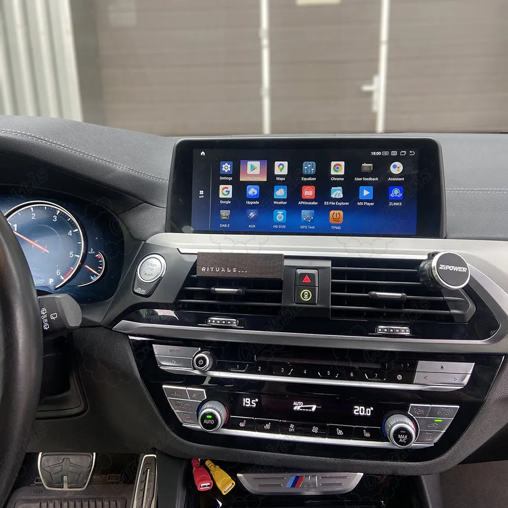 Android head unit display with app icons installed in BMW X3 F25 X4 F26 central dashboard.