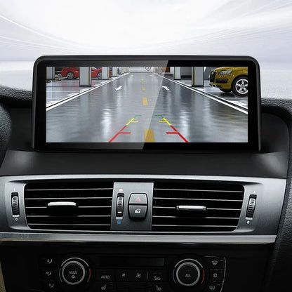 Backup camera display with parking trajectory guidelines on BMW X3 F25 X4 F26 multimedia screen.