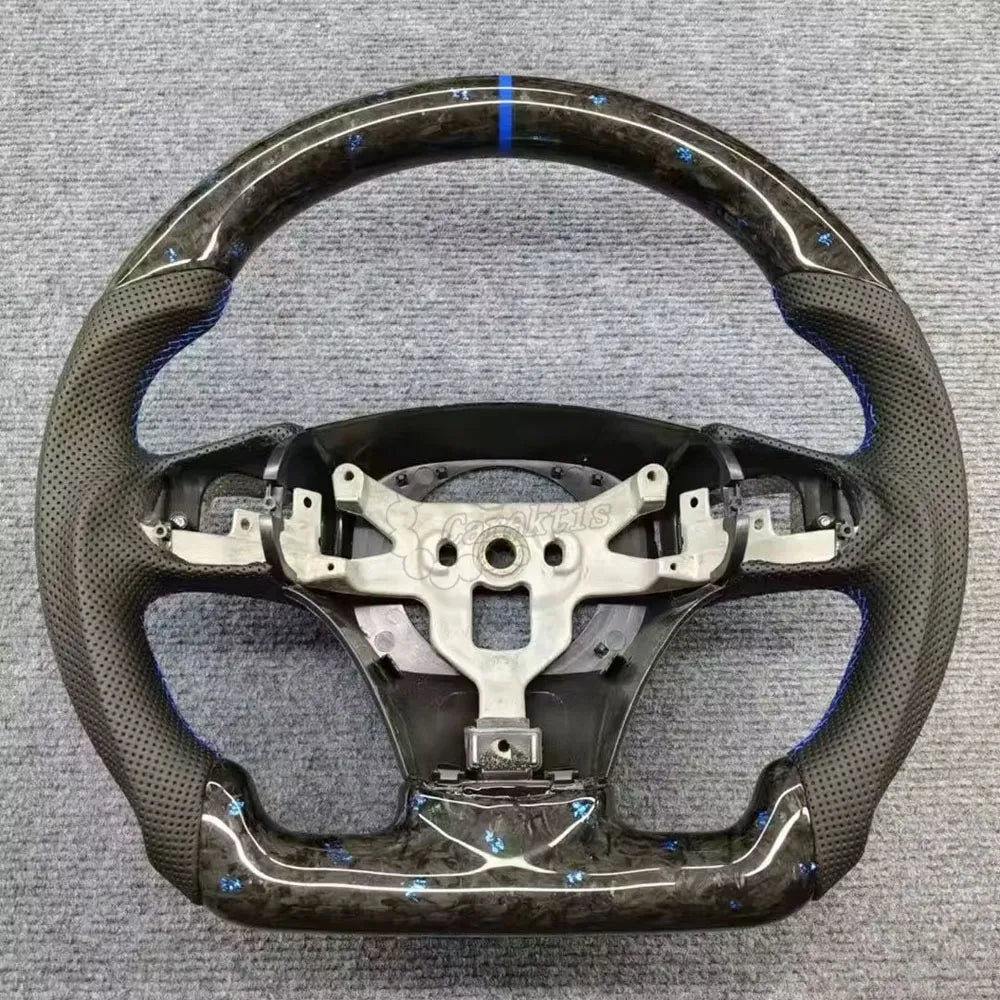 2006-2013 C6 Corvette custom forged carbon fiber steering wheel with blue accents and leather grips.
