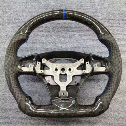 2006-2013 C6 Corvette custom forged carbon fiber steering wheel with blue accents and leather grips.