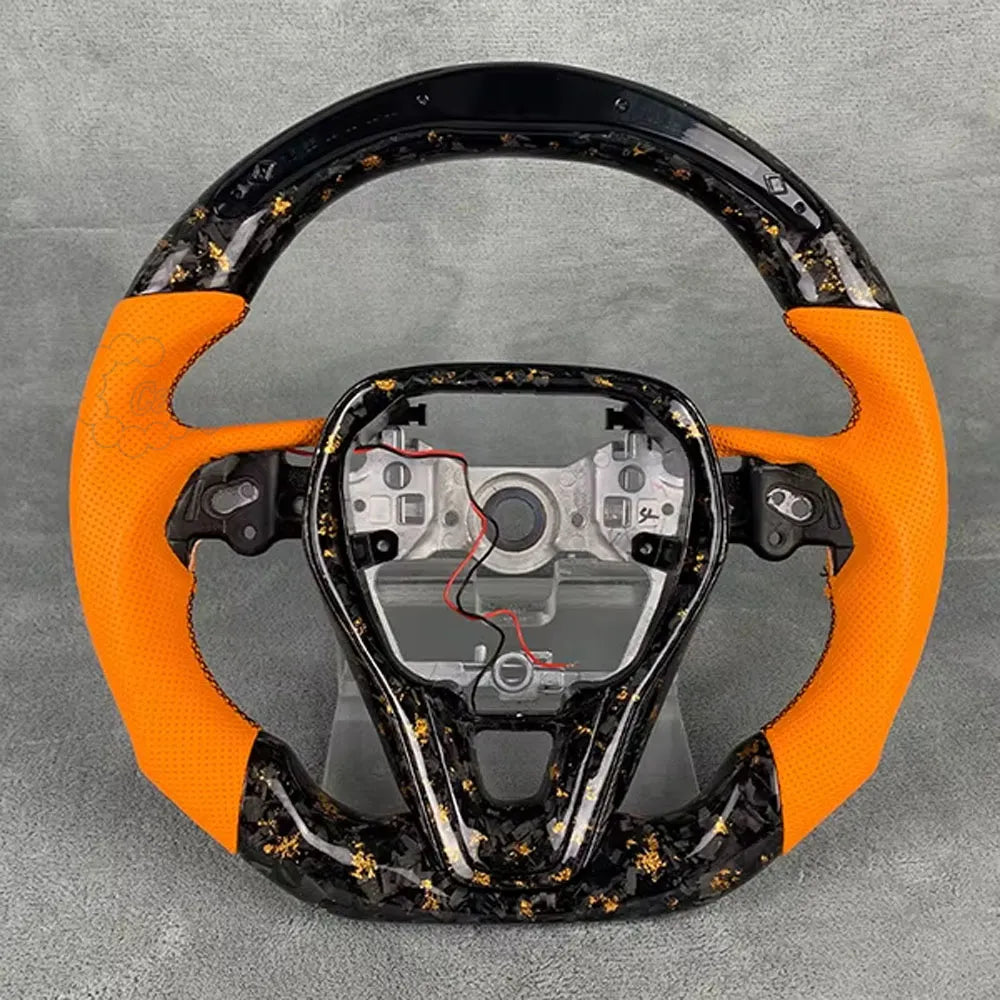 2006-2013 C6 Corvette custom steering wheel with forged carbon gold flake finish and orange leather.