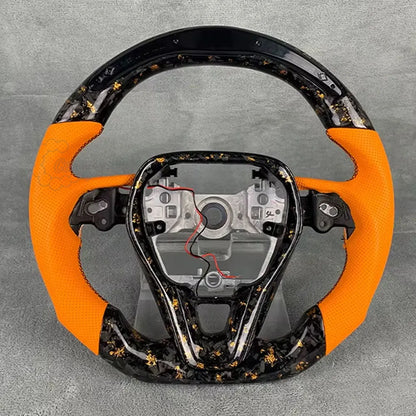 2006-2013 C6 Corvette custom steering wheel with forged carbon gold flake finish and orange leather.