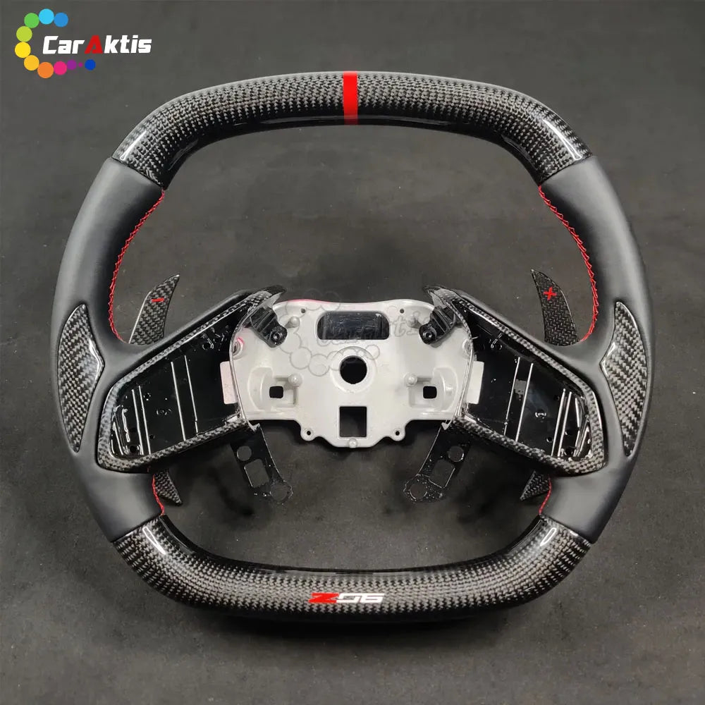 Detail of black Alcantara side grips with hand-sewn red contrast stitching for C8 Corvette steering wheel.