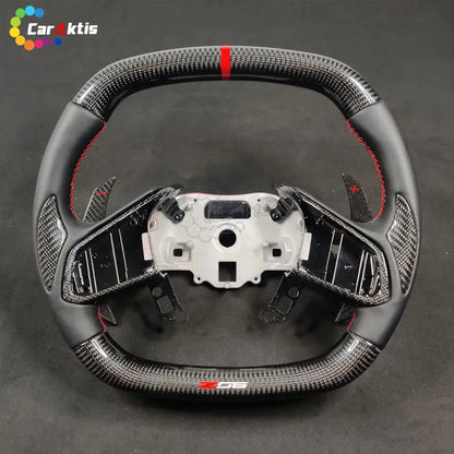 Detail of black Alcantara side grips with hand-sewn red contrast stitching for C8 Corvette steering wheel.