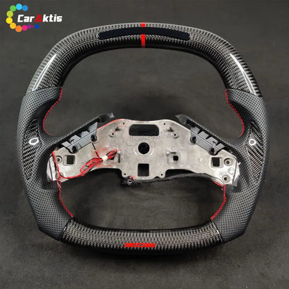 Close-up of premium 3K twill carbon fiber weave on a custom Chevrolet C8 Corvette steering wheel.