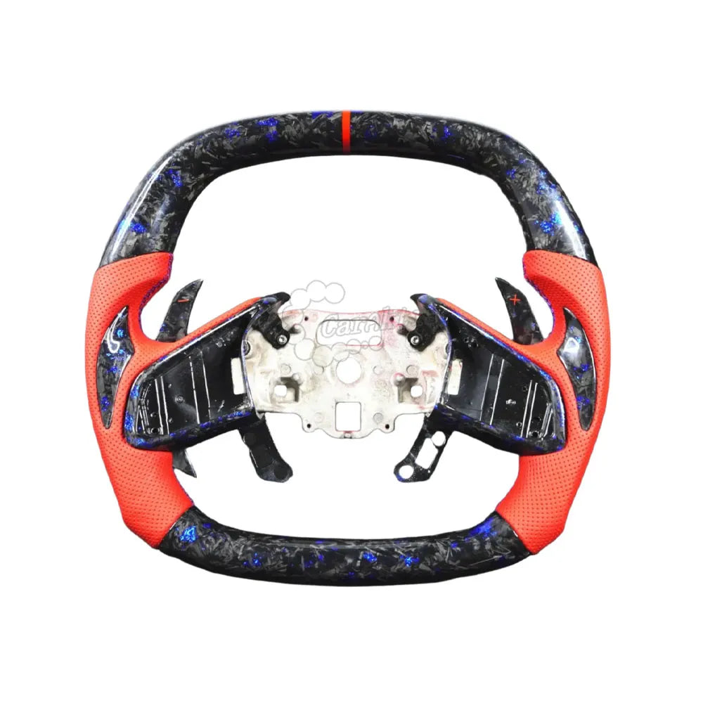 Custom Chevrolet C8 Corvette steering wheel featuring high-gloss carbon fiber top and bottom, black perforated leather side grips, and sporty red contrast stitching with a red 12 o&