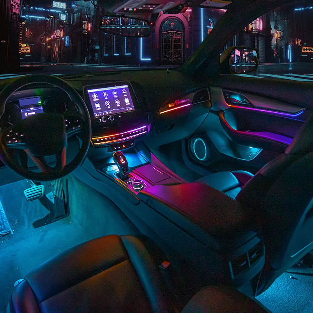 Full set premium interior LED ambient lights glowing perfectly along the dashboard contours of a Cadillac CT5.