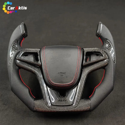 Custom Chevrolet Camaro steering wheel with gloss carbon fiber and black perforated leather side grips.