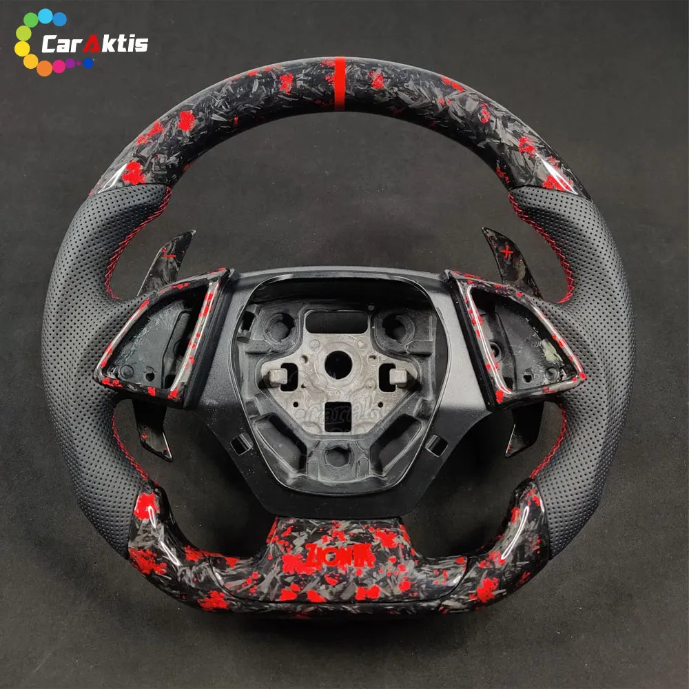 Custom Chevrolet Camaro steering wheel with red flake forged carbon fiber and black perforated leather grips with red contrast stitching.