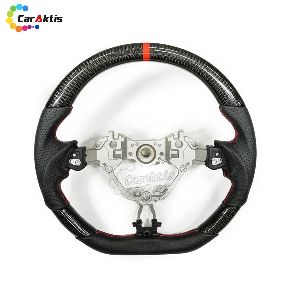 Matte carbon fiber steering wheel with perforated leather grips for 2016-2024 Toyota GR86 and Subaru BRZ.