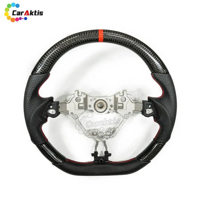Matte carbon fiber steering wheel with perforated leather grips for 2016-2024 Toyota GR86 and Subaru BRZ.