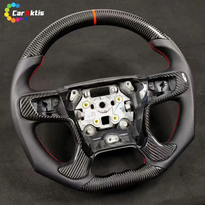 Custom Chevy Tahoe steering wheel featuring forged carbon fiber, black Alcantara, and sporty red stitching.