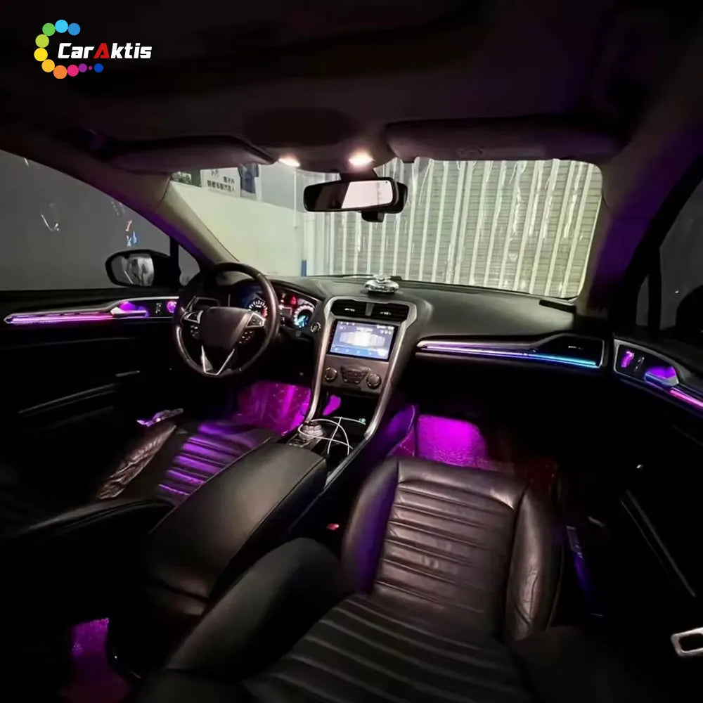 Full interior view of Ford Mondeo with dynamic multi-color ambient lighting kit installed on dashboard, footwells, and doors.