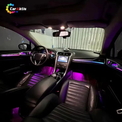 Full interior view of Ford Mondeo with dynamic multi-color ambient lighting kit installed on dashboard, footwells, and doors.