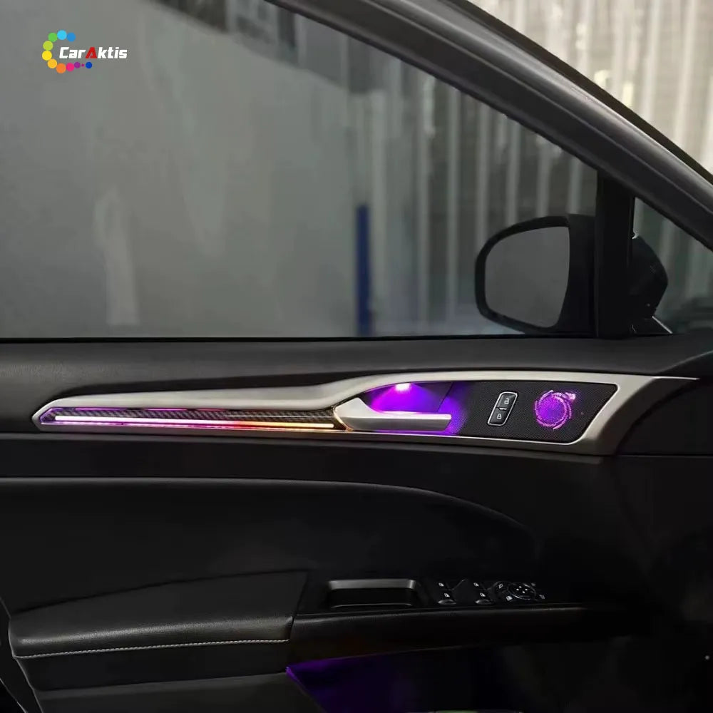 Side view of Ford Mondeo interior door panel featuring synchronized RGB ambient light strips and illuminated accents.