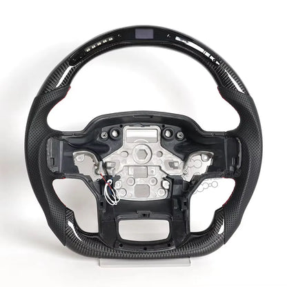 erformance LED carbon fiber steering wheel for Ford F-150 Raptor (2015-2026) featuring gloss black finish, real-time shift light indicator, and sporty red stitching.