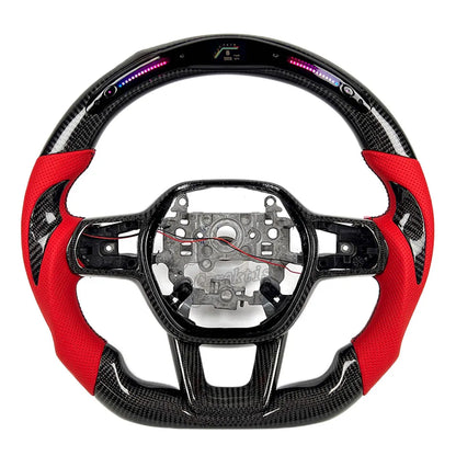 Stunning contrast between premium gloss black carbon fiber and high-quality red racing leather grips on a custom steering wheel.