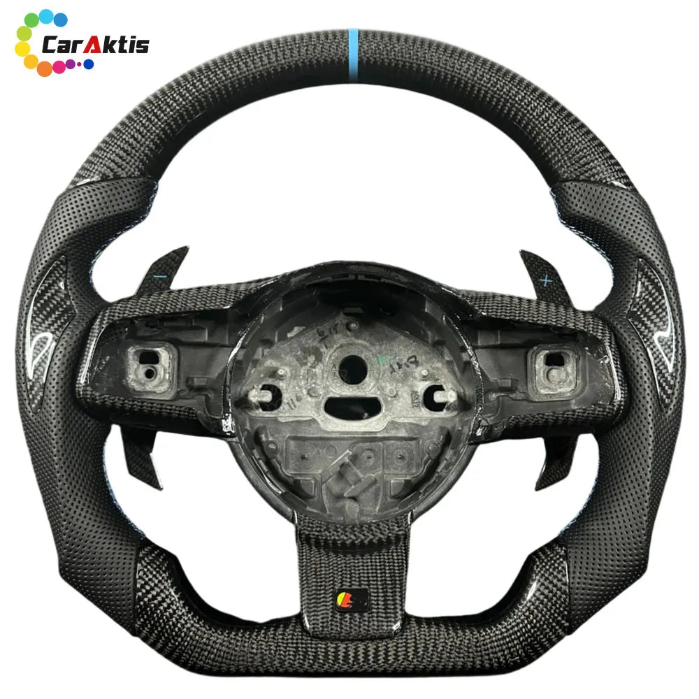 A close-up of the glossy carbon fiber steering wheel, accented by contrasting white stitching, showcases exquisite craftsmanship.