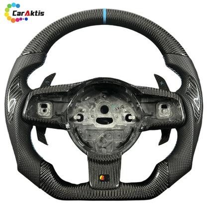 A close-up of the glossy carbon fiber steering wheel, accented by contrasting white stitching, showcases exquisite craftsmanship.