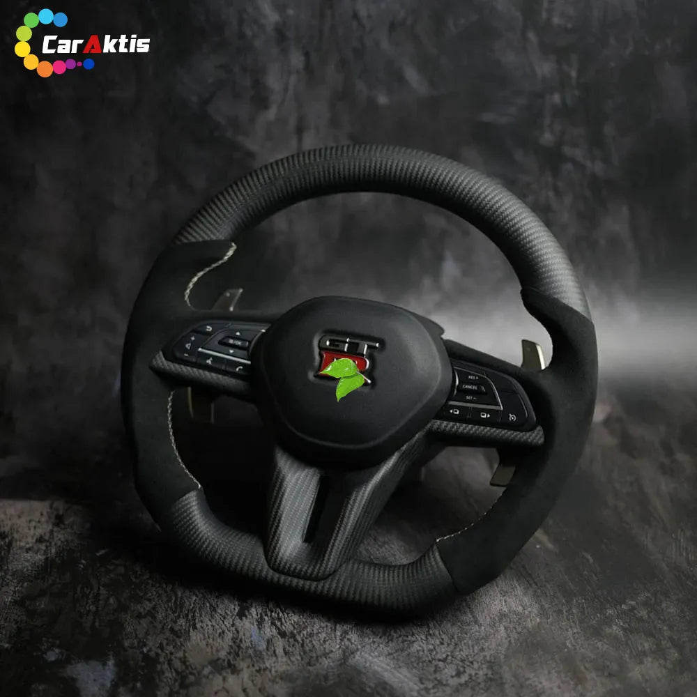 Luxury matte carbon fiber and Alcantara steering wheel for Nissan GTR R35 with white contrast stitching.
