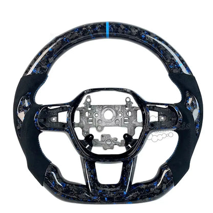 Custom Honda Civic steering wheel with unique blue forged carbon fiber, dark grey suede grips, and matching blue stitching for a premium racing interior by Caraktis.