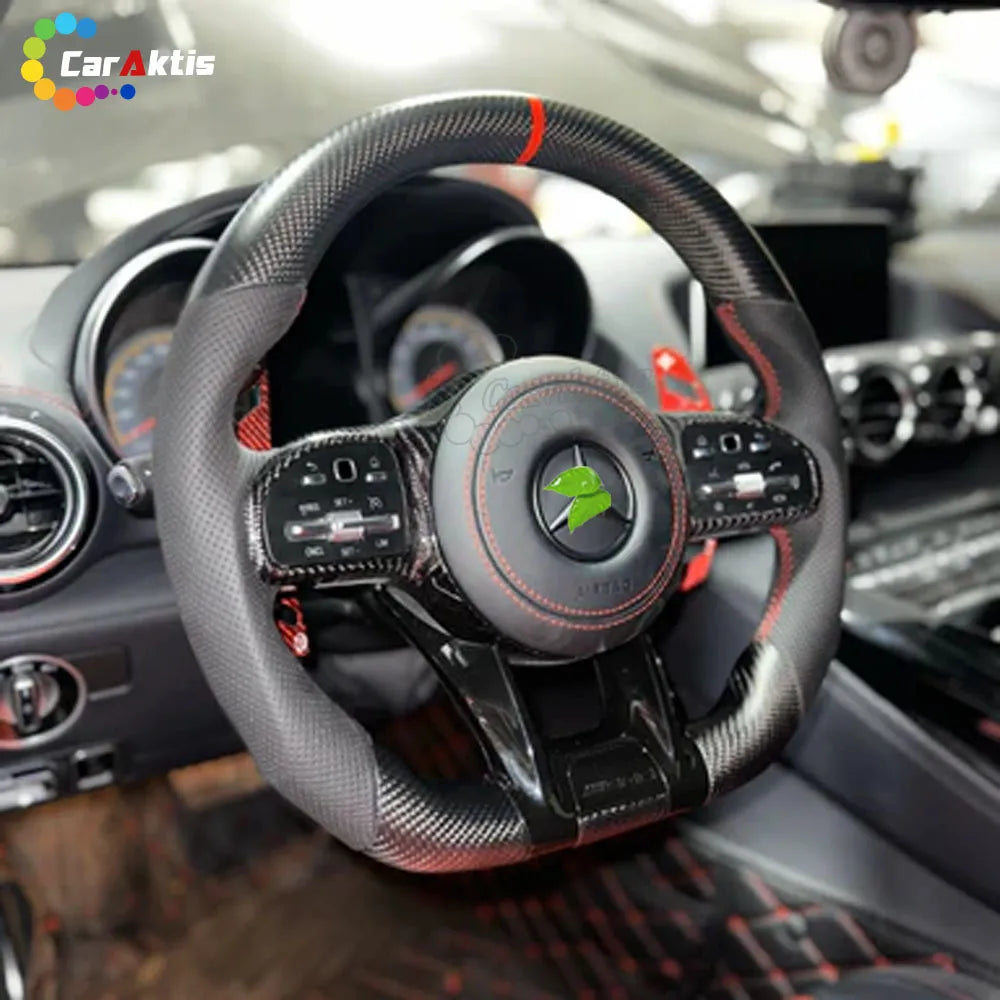 Interior view of a 2018+ Mercedes Sprinter W907 showing an installed carbon fiber steering wheel with red accents.