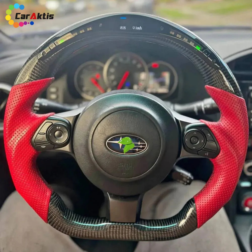 Interior view of a custom carbon fiber steering wheel installed in a 2017 Subaru BRZ cockpit.
