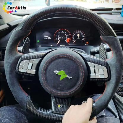 A custom steering wheel—featuring glossy carbon fiber paired with an Alcantara suede grip—creates the ultimate sporty atmosphere for the Jaguar F-Type.