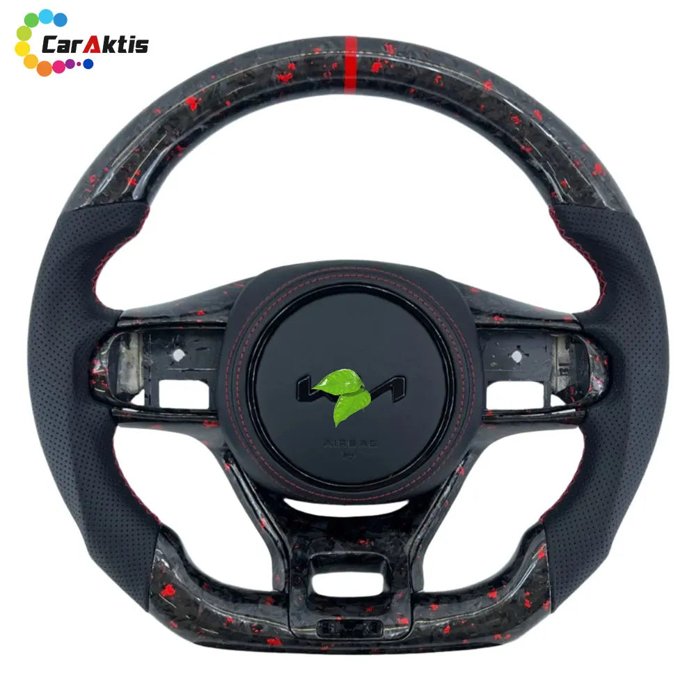 Custom steering wheel for Kia K5 featuring unique red shredded forged carbon fiber, premium black perforated leather, and matching red stitching.
