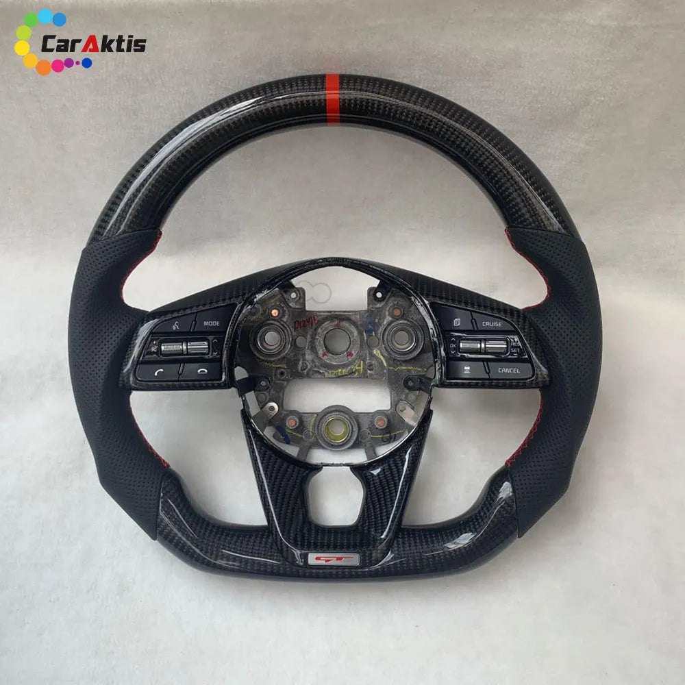 Custom Kia Stinger steering wheel featuring glossy carbon fiber, black perforated leather with red stitching, and a sporty red 12 o&