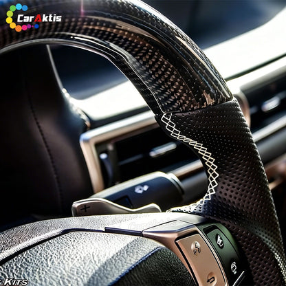High-definition close-up of the 3K twill carbon fiber weave on a Lexus ES GS steering wheel, featuring a premium high-gloss UV-resistant clear coat.