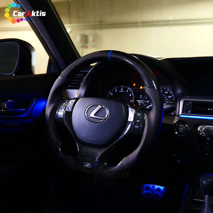 Ergonomic perforated leather grips on a custom Lexus ES carbon fiber steering wheel for enhanced handling and comfort.